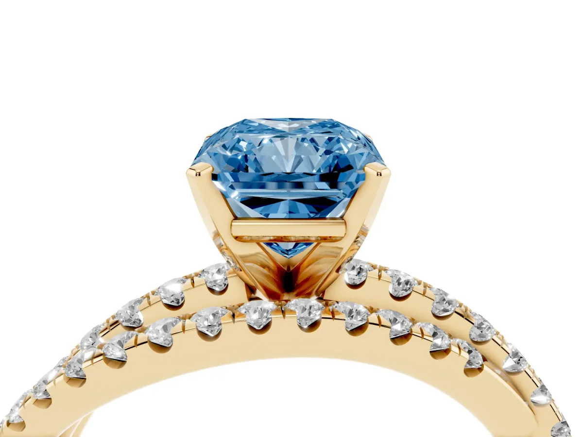 Fancy Blue Radiant Cut Solitaire Twist Band with Pavé Setting and Four-Prong Setting Yellow gold