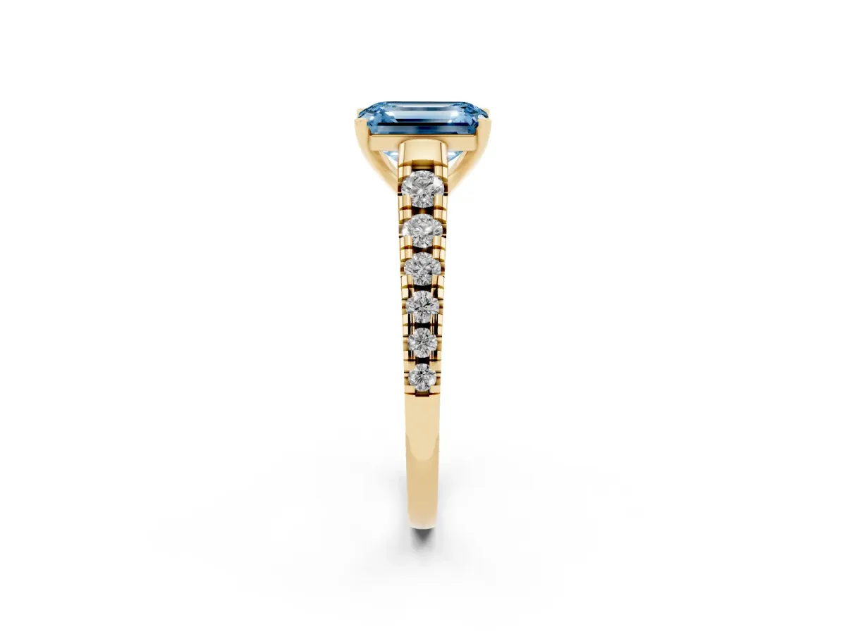 Fancy Blue Emerald Cut Diamond Cathedral Solitaire Ring with Round Pavé Band Yellow gold