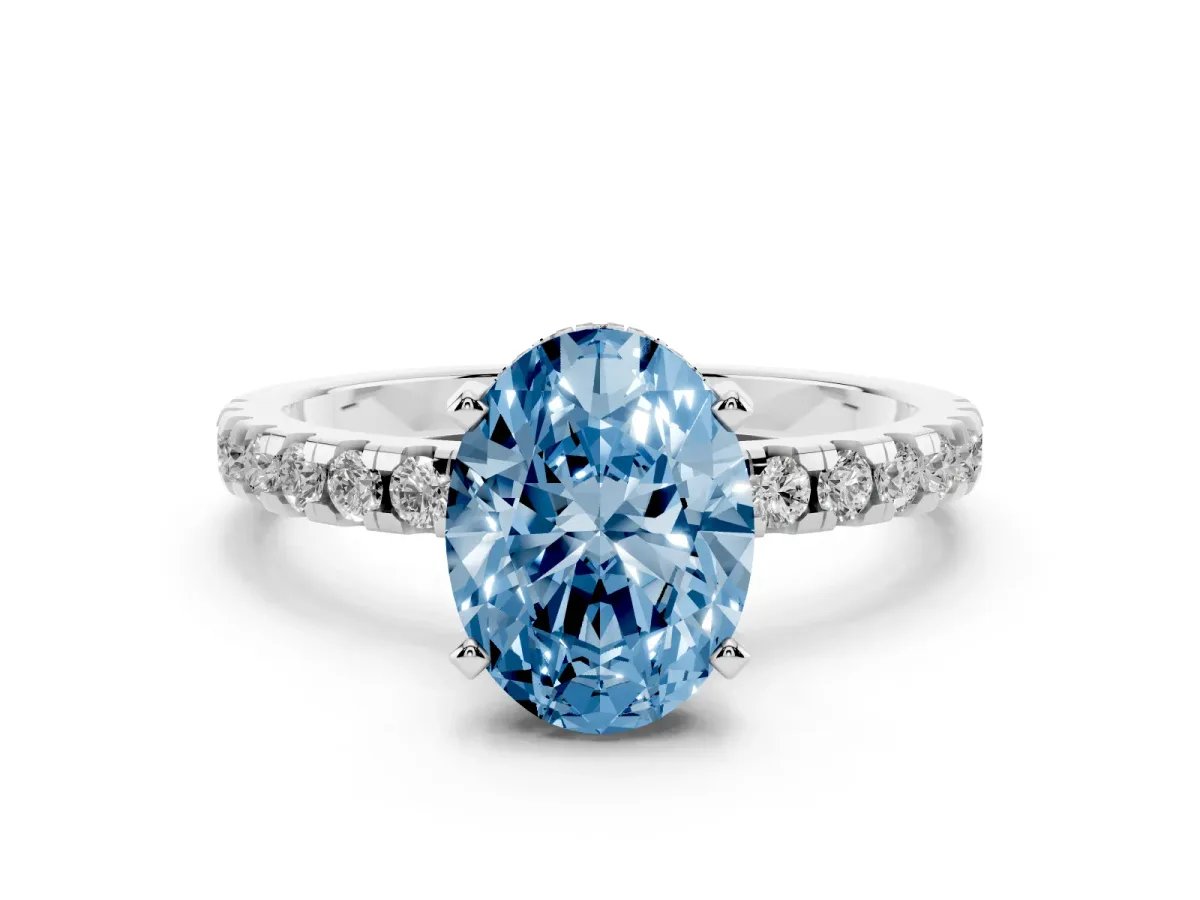 Fancy Blue Oval Cut Diamond Solitaire Ring with Round Pavé Band and Four-Prong Setting Silver