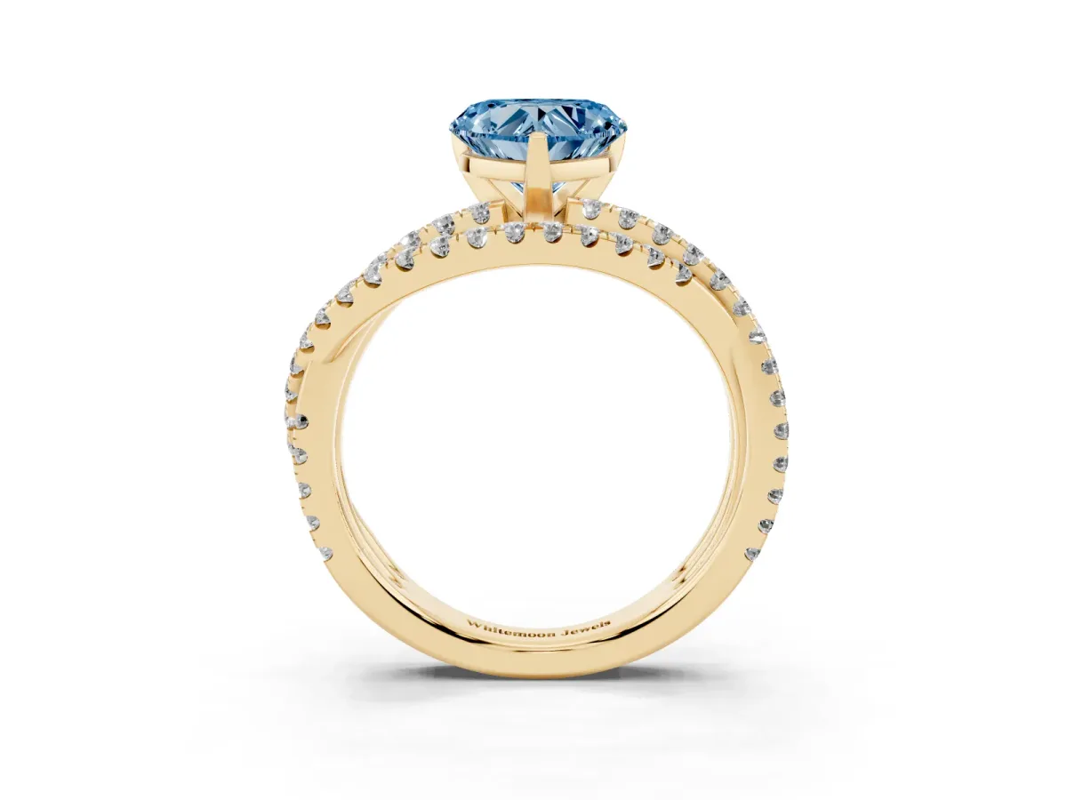 Fancy Blue Heart Cut Solitaire Twist Band with Pavé Setting and Four-Prong Setting Yellow gold