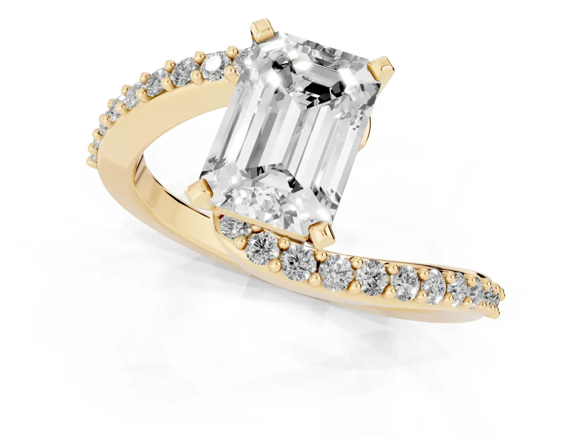 Emerald Cut Solitaire Twist Band with Pave Set Diamonds and Four-Prong Setting Yellow gold
