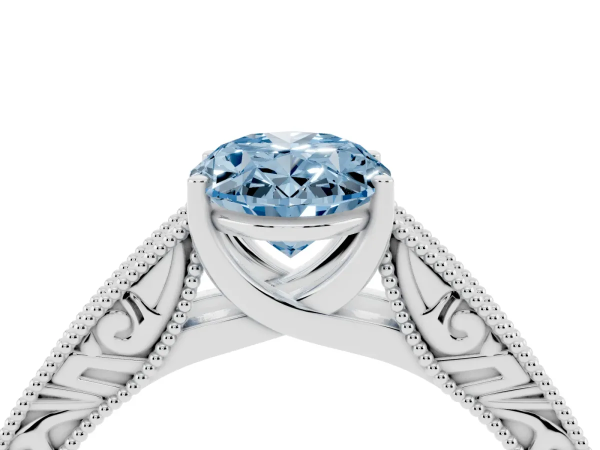 Fancy Blue Oval Cut Diamond Solitaire Ring with Engraved Band and Four-Prong Setting Silver