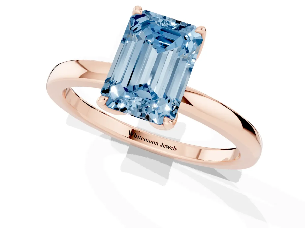 Fancy Blue Emerald Cut Diamond Solitaire Ring with Thin Band and Prong Setting Rose gold