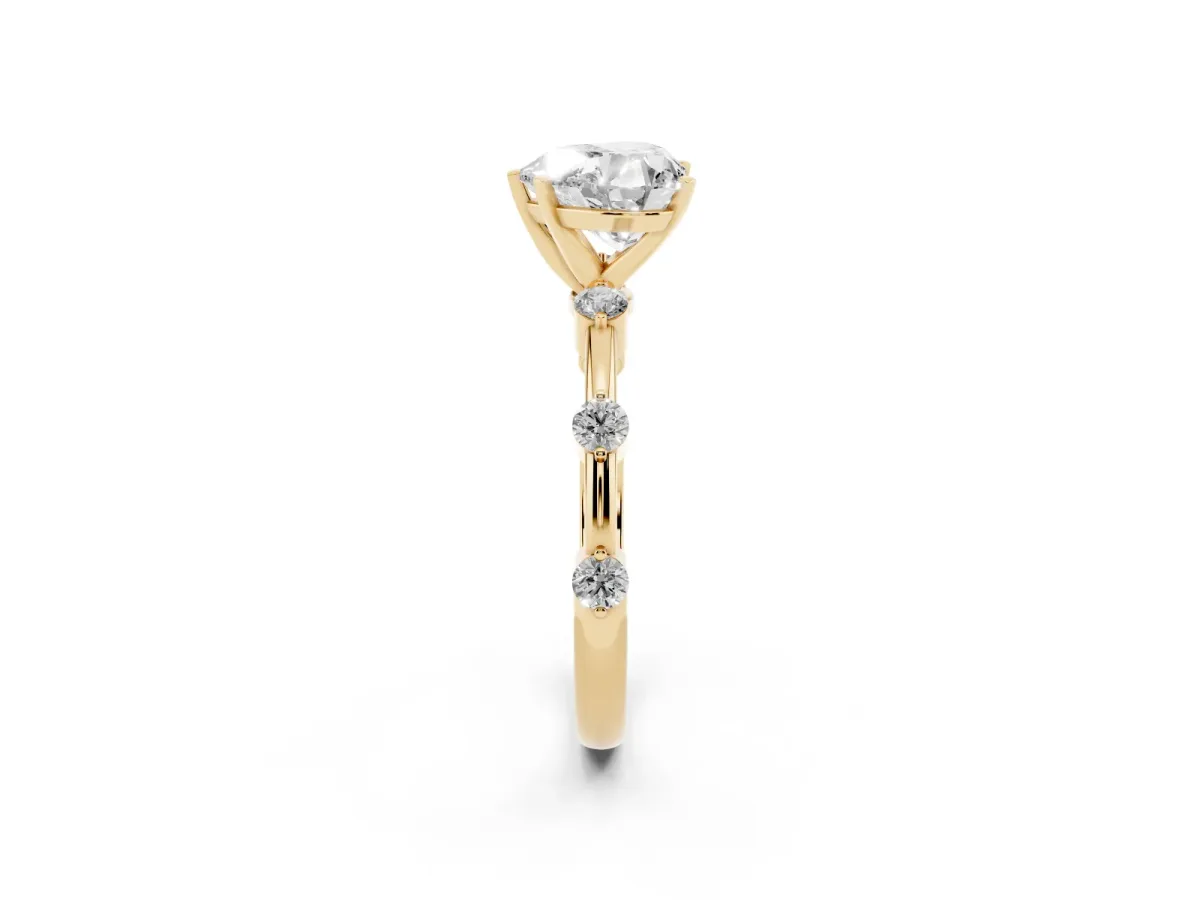 Heart Cut Solitaire Diamond Ring with Bezel Set Side Stones and Prong Setting Yellow gold