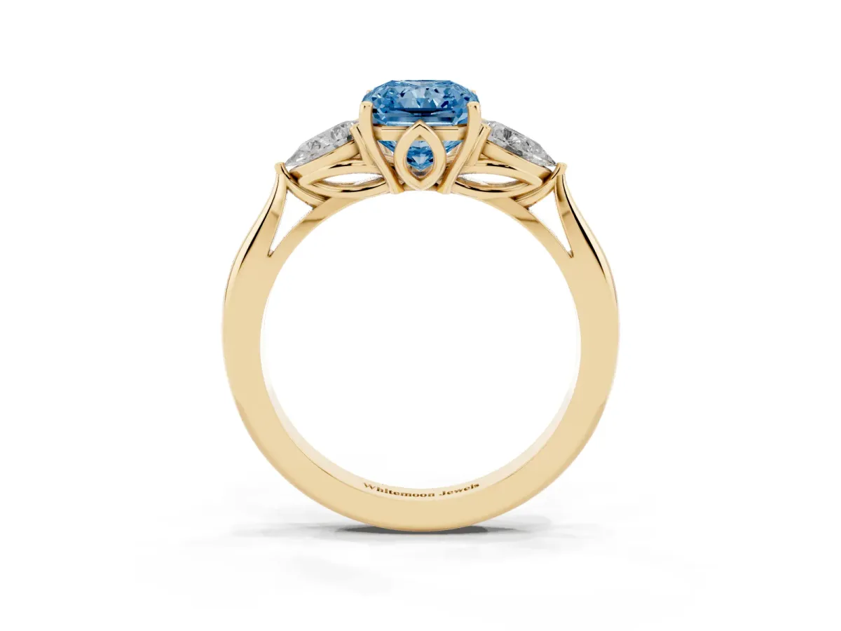 Fancy Blue Three-Stone Radiant Cut Brilliant Diamond Solitaire Ring with Tapered Band and Four-Prong Setting Yellow gold