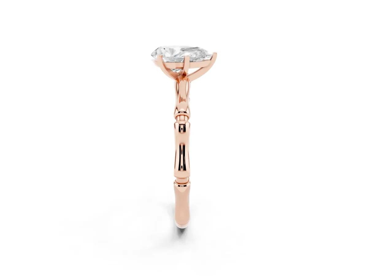 Pear Cut Solitaire Diamond Ring with Bamboo Band and Four-Prong Setting Rose gold