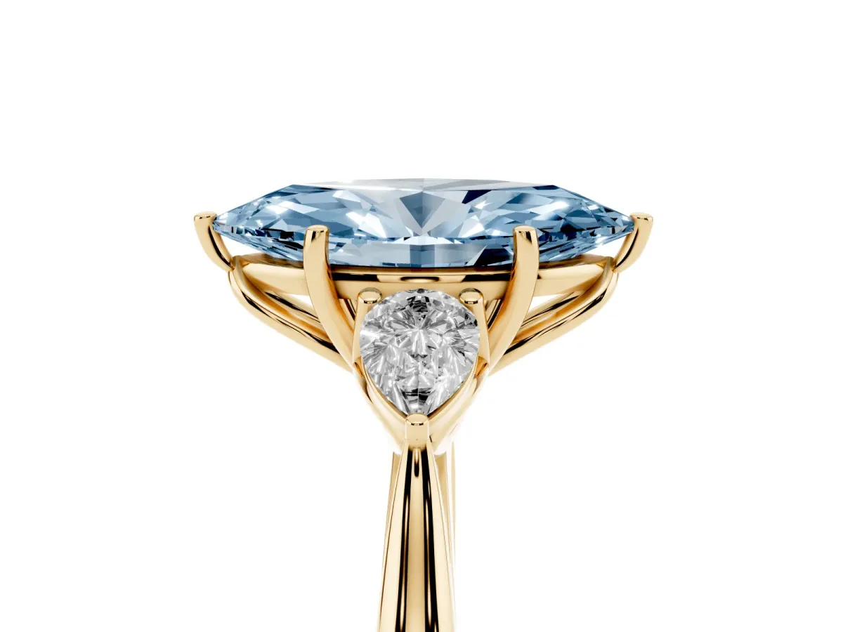 Fancy Blue Three-Stone Marquise Cut Brilliant Diamond Solitaire Ring with Tapered Band and Four-Prong Setting Yellow gold