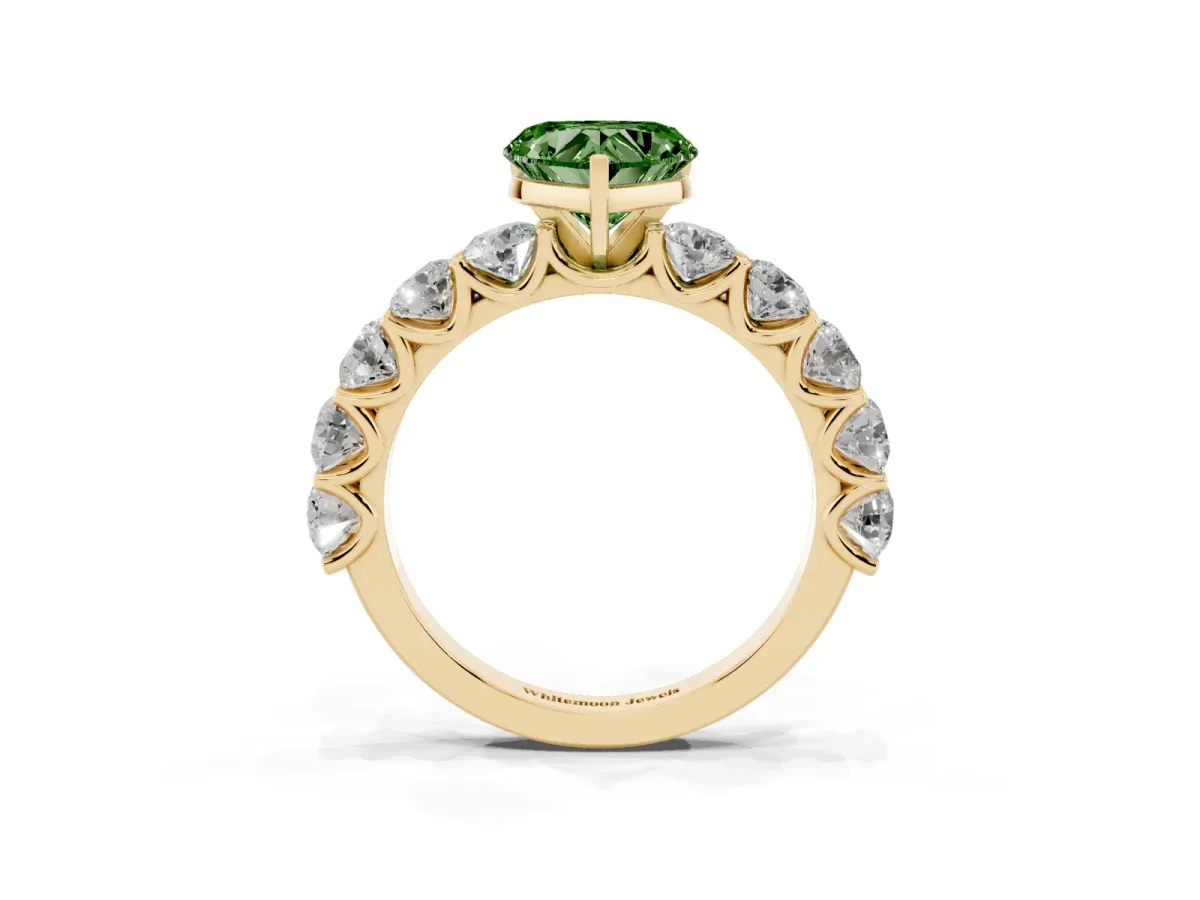 Fancy Green Heart Cut Diamond Prong Setting with Side Stones on a Pave Band Yellow gold