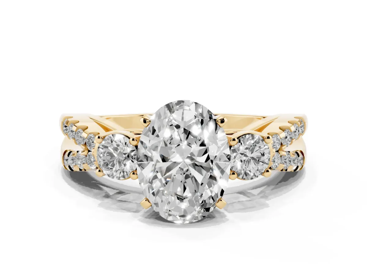 Oval Cut Diamond Three-Stone Ring with Pavé Split Shank and Four-Prong Setting Yellow gold