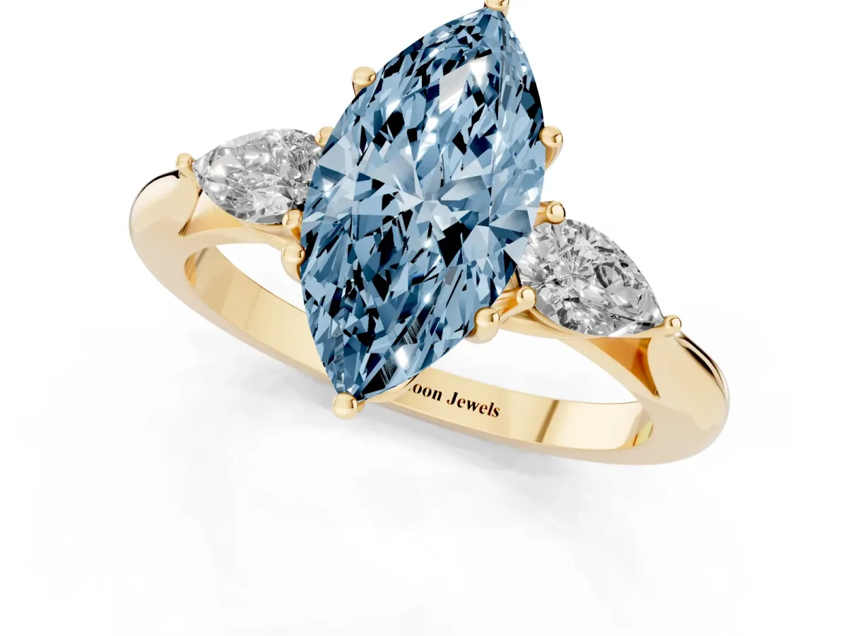Fancy Blue Three-Stone Marquise Cut Brilliant Diamond Solitaire Ring with Tapered Band and Four-Prong Setting Yellow gold