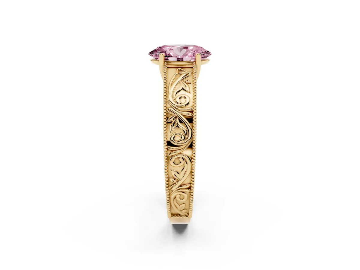 Fancy Pink Oval Cut Diamond Solitaire Ring with Engraved Band and Four-Prong Setting Yellow gold