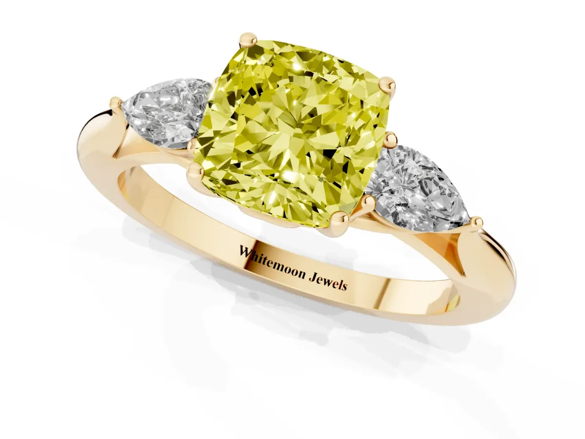 Fancy Yellow Cushion Cut Diamond Three-Stone Ring with Pear Side Stones and Prong Setting Yellow gold