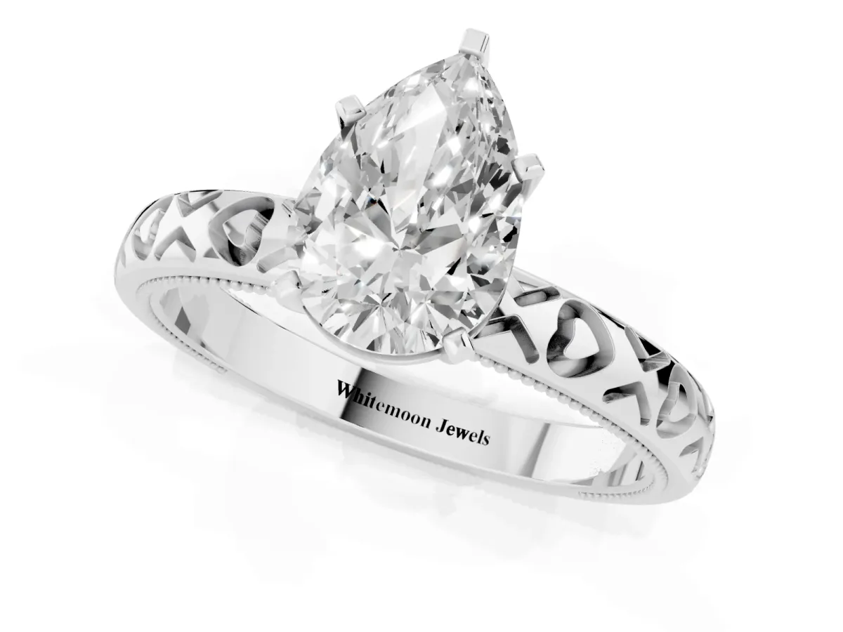 Pear Cut Solitaire Diamond Engagement Ring with XO Engraved Band and Four-Prong Setting White gold