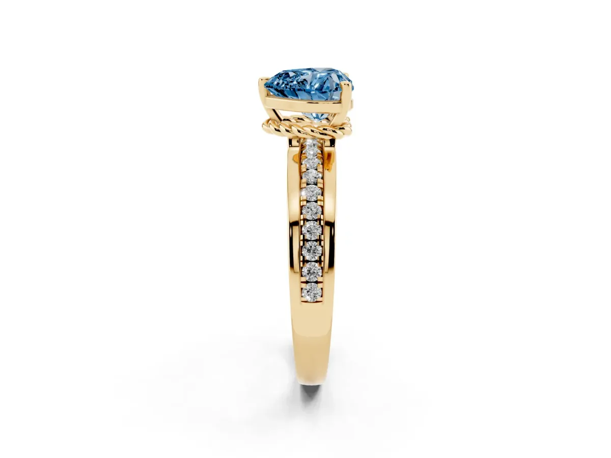 Fancy Blue Heart Cut Solitaire Diamond Ring with Channel Set Band and Six-Prong Setting Yellow gold