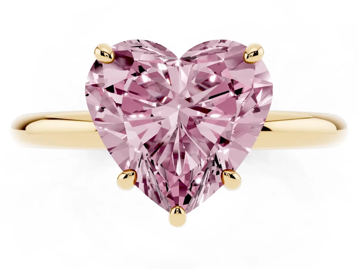 Fancy Pink Heart Cut Solitaire Diamond Ring with Four-Prong Setting on a Plain Band Yellow gold