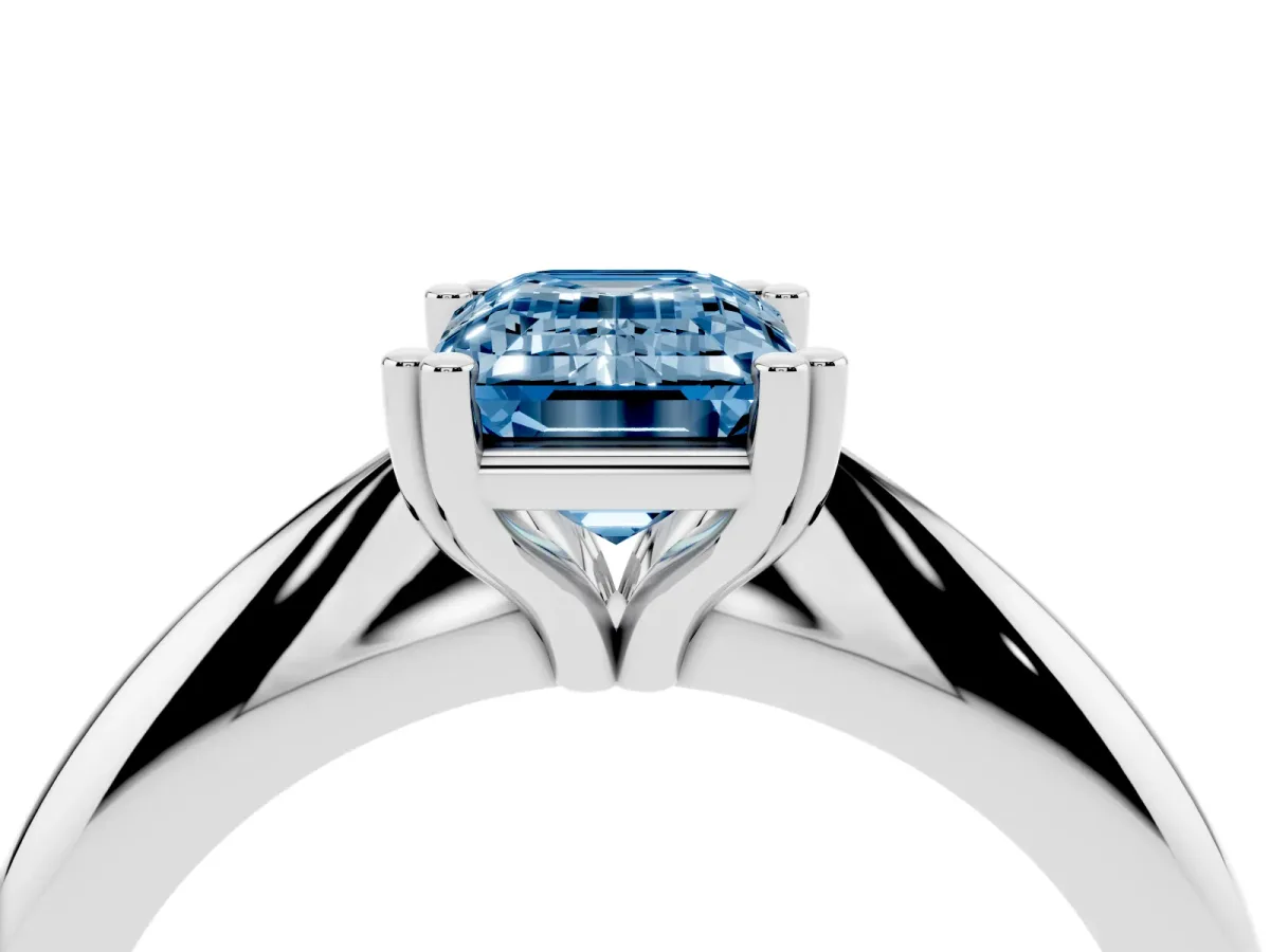 Fancy Blue Emerald Cut Cut Solitaire Engagement Ring with Tapered Band and Four-Prong Setting Silver