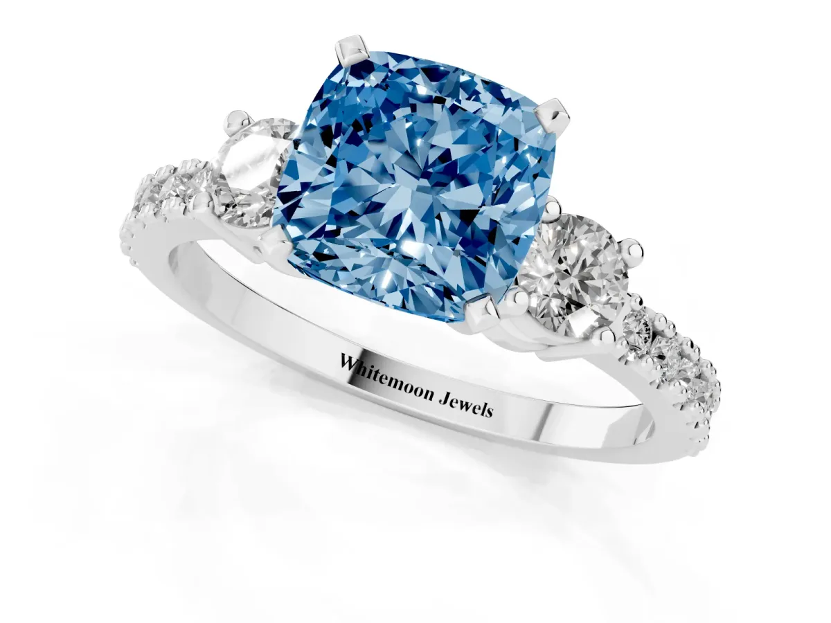 Fancy Blue Cushion Cut Three-Stone Diamond Pavé Band with Prong Setting Platinum