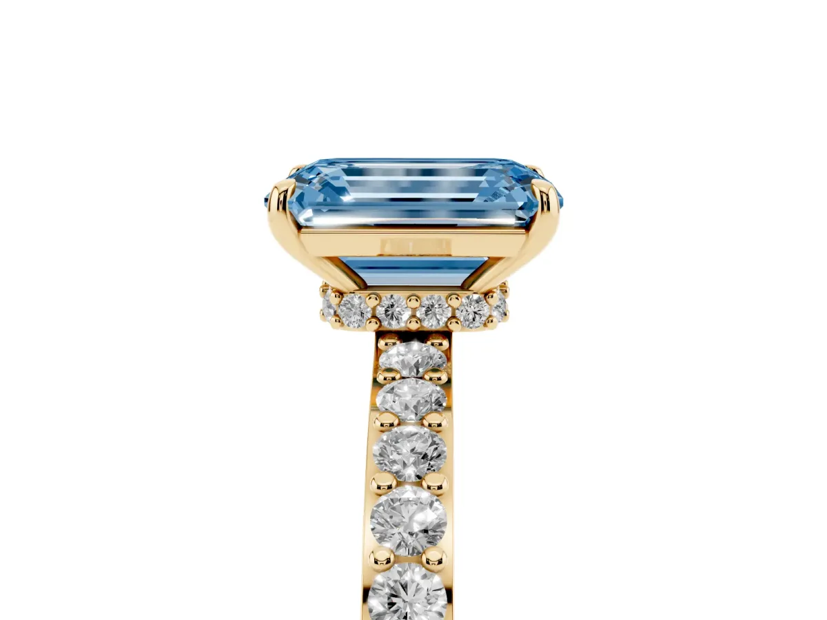 Fancy Blue Emerald Cut Diamond Solitaire Engagement Ring with Pavé Band and Four-Prong Setting Yellow gold