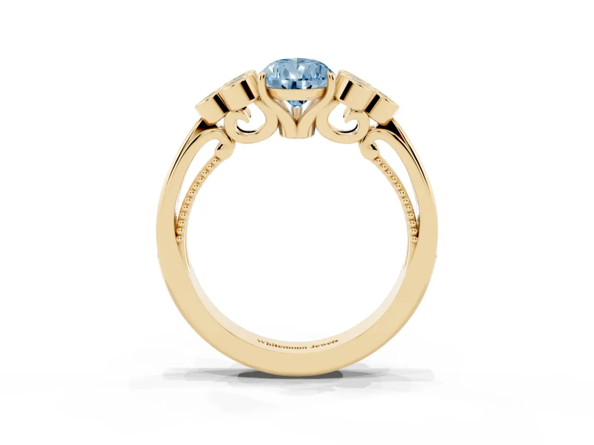 Fancy Blue Pear Cut Cut Diamond Engagement Ring with Bezel Set Round Side Stones and Prong Setting Yellow gold