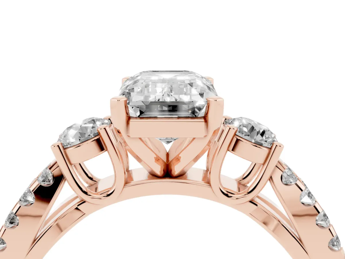 Emerald Cut Diamond Three-Stone Ring with Pavé Split Shank and Four-Prong Setting Rose gold