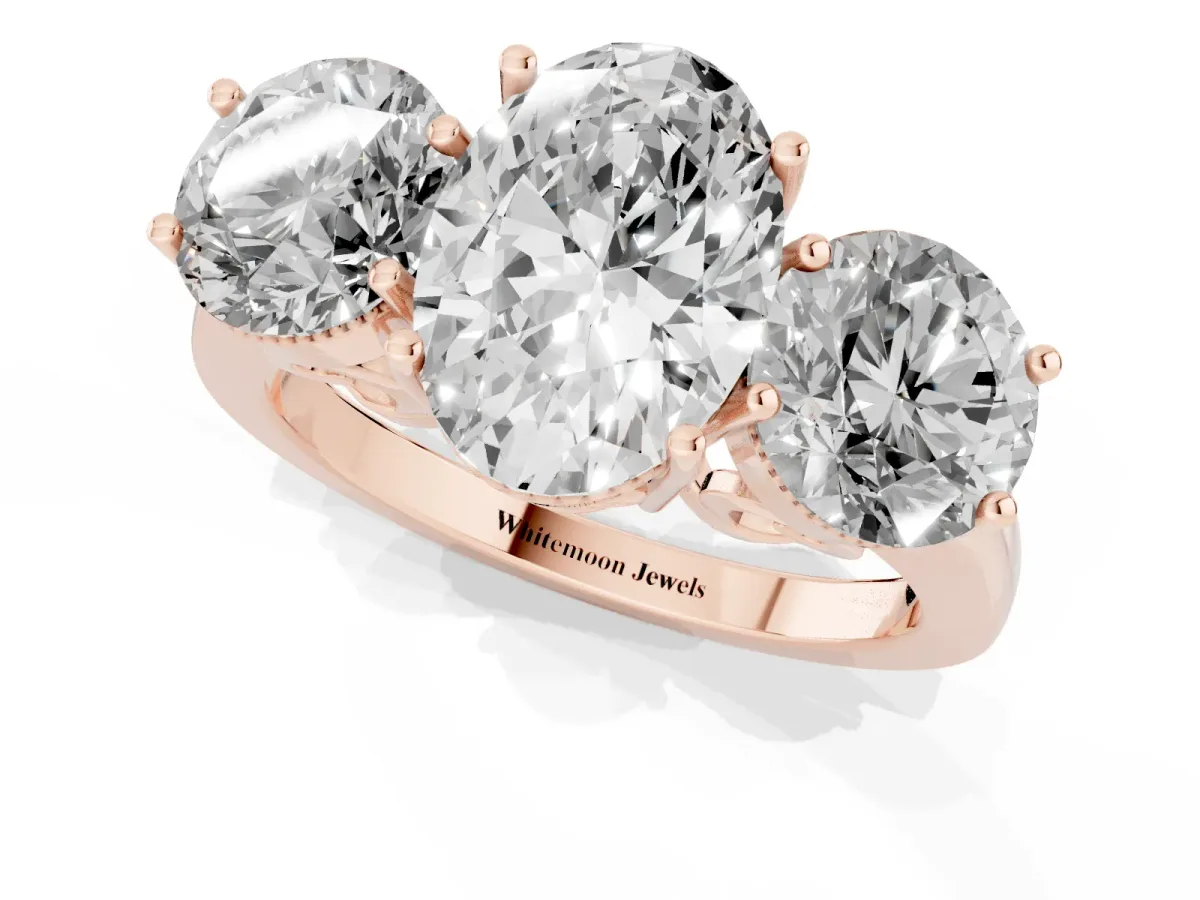 Three-Stone Oval Cut Diamond Engagement Ring with Prong Setting on a Classic Band Rose gold