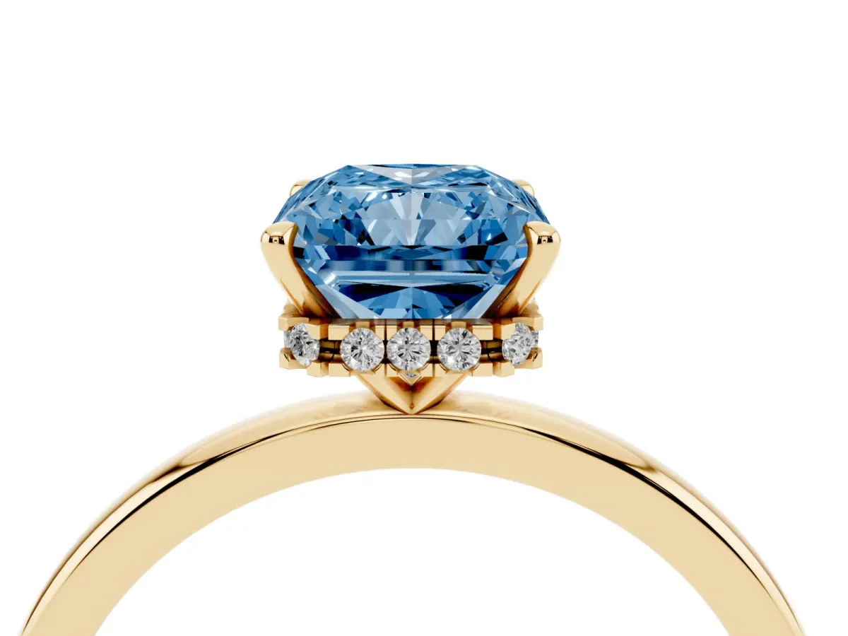 Fancy Blue Radiant Cut Solitaire Engagement Ring with Cathedral Band and Four-Prong Setting Yellow gold