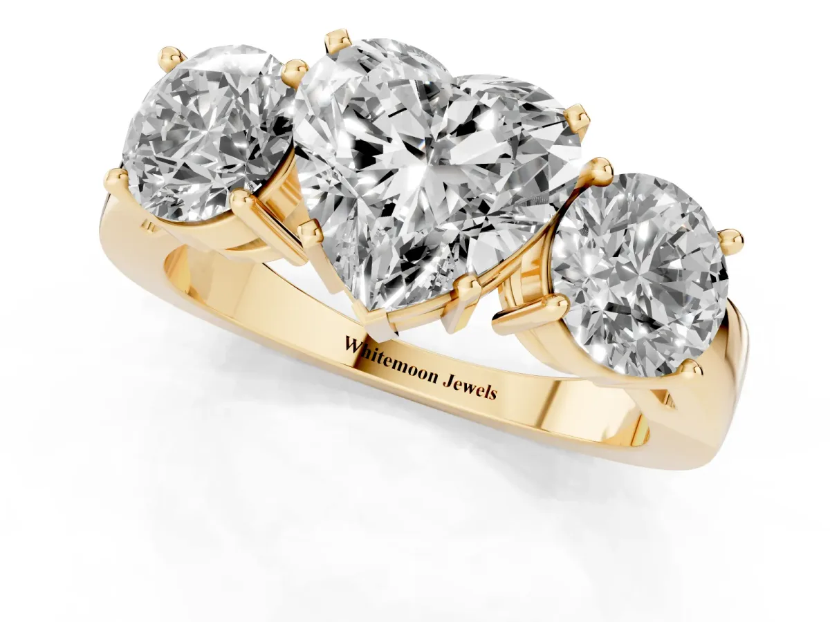 Three-Stone Heart Cut Diamond Ring with Round Side Stones, Classic Band, and Four-Prong Setting Yellow gold