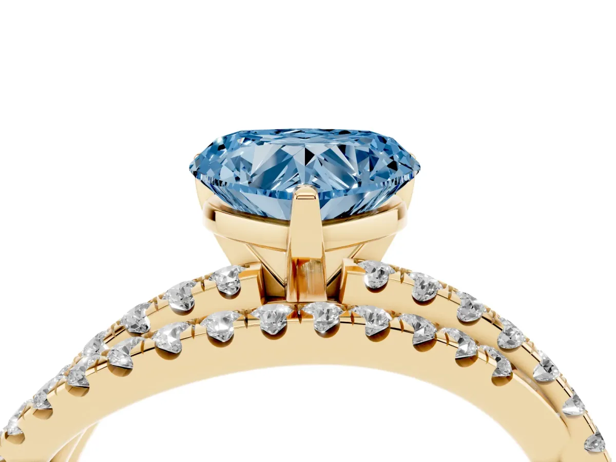 Fancy Blue Heart Cut Solitaire Twist Band with Pavé Setting and Four-Prong Setting Yellow gold