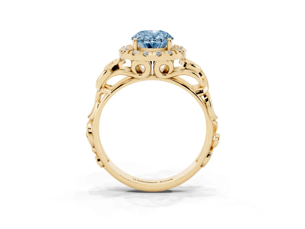 Fancy Blue Oval Cut Cut Halo Diamond Ring with Scrollwork Band and Four-Prong Setting Yellow gold