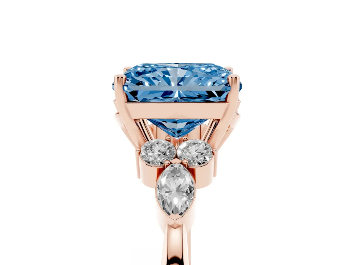 Fancy Blue Radiant Cut Brilliant Diamond Solitaire Ring with Pear Side Stones and Four-Prong Setting Rose gold