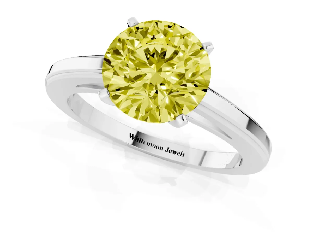 Fancy Yellow Round Cut Solitaire Diamond Ring with Four-Prong Setting and Classic Band Platinum