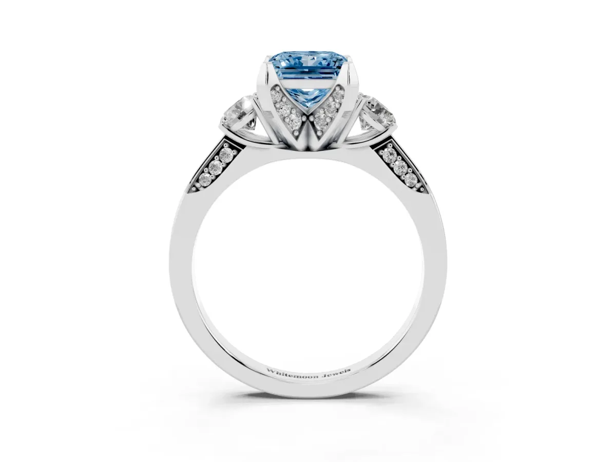 Fancy Blue Princess Cut Brilliant Three-Stone Diamond Ring with Pavé Band and Four-Prong Setting Silver