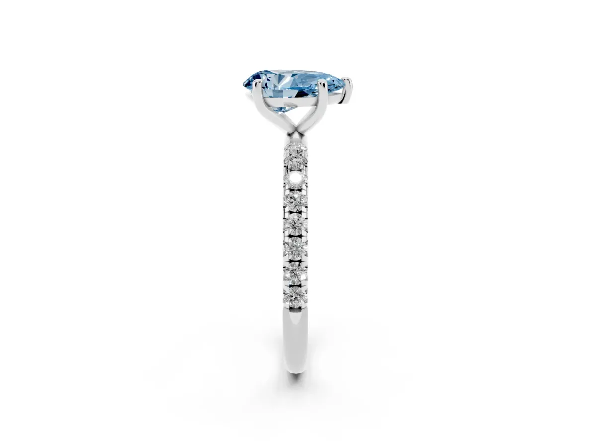Fancy Blue Pear Cut Cut Diamond Solitaire Ring with Micro Pave Band and Four Prong Setting Silver