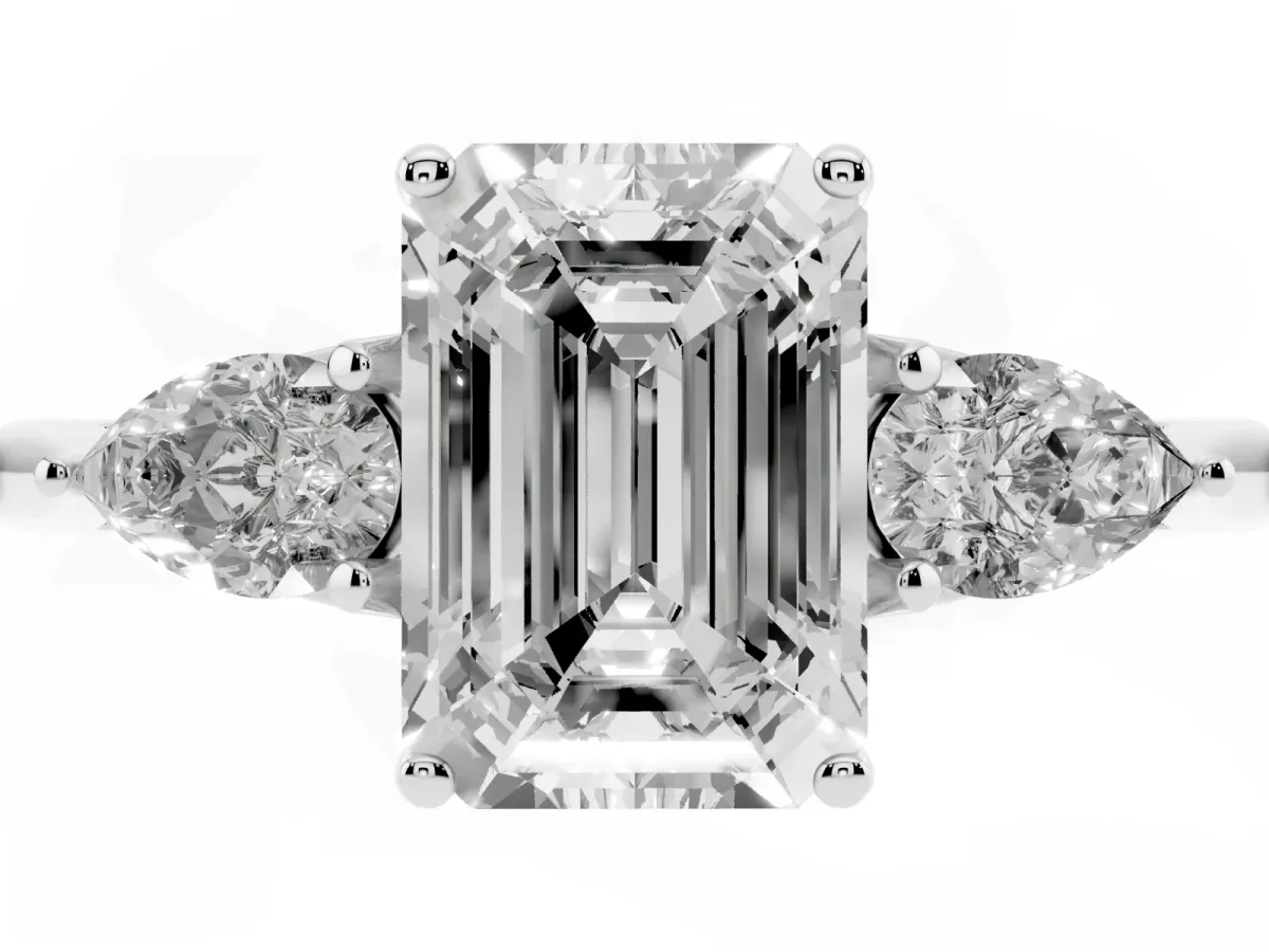 Three-Stone Emerald Cut Diamond Ring with Pear Side Stones in Four-Prong Setting Platinum