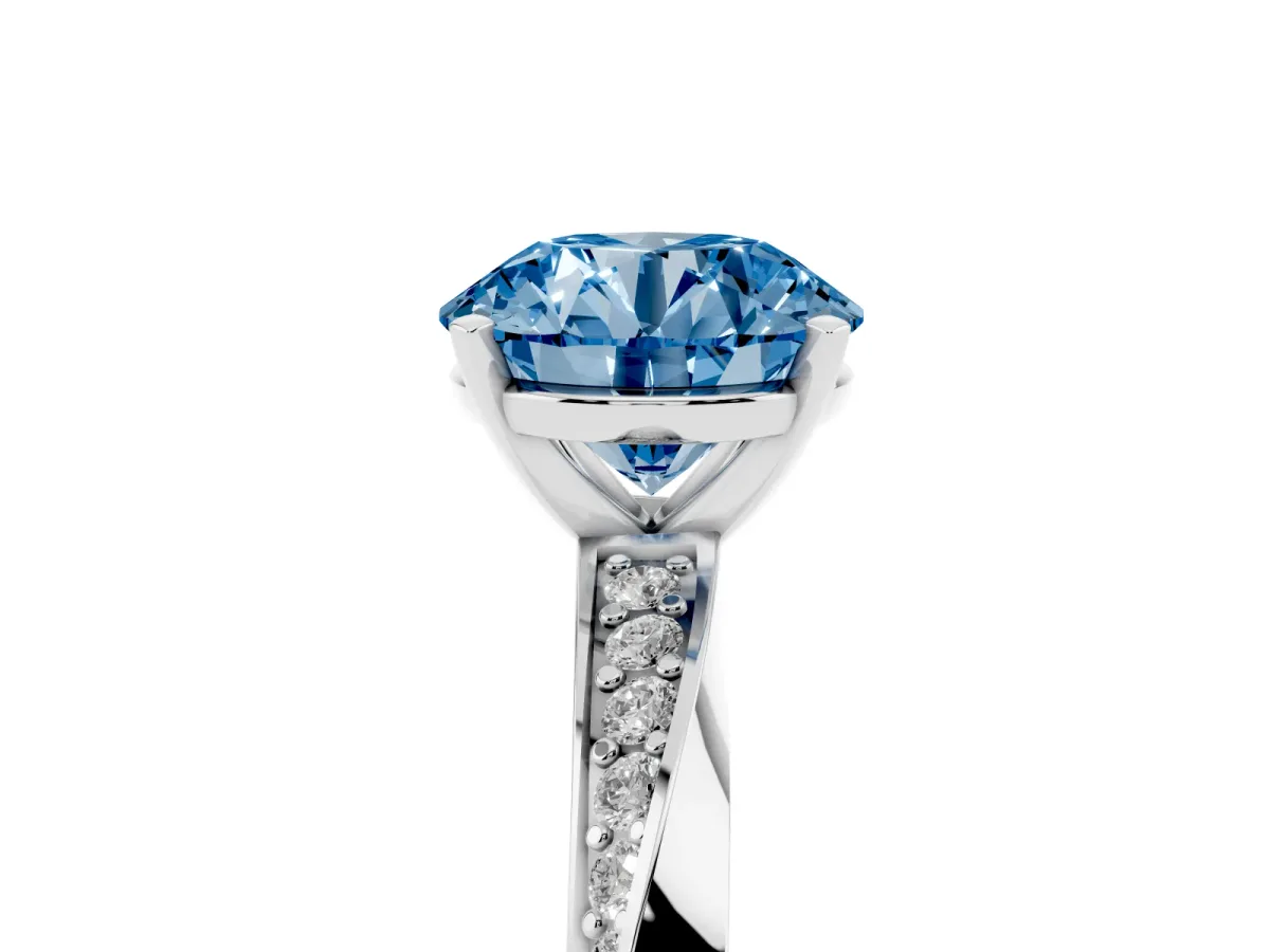 Fancy Blue Round Cut Diamond Engagement Ring with Side Stone Accents and Four-Prong Setting Silver