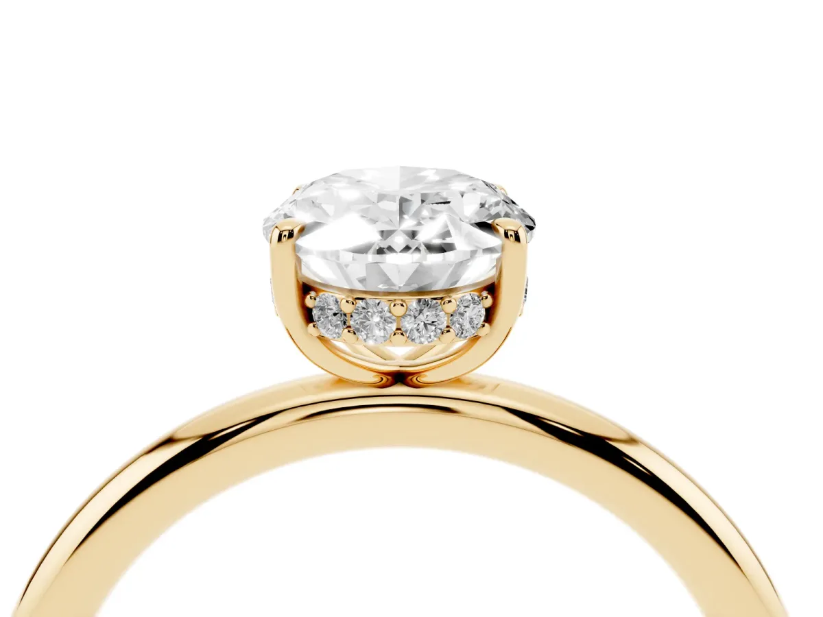 Oval Cut Diamond Solitaire Ring with Thin Band and Four-Prong Setting Yellow gold