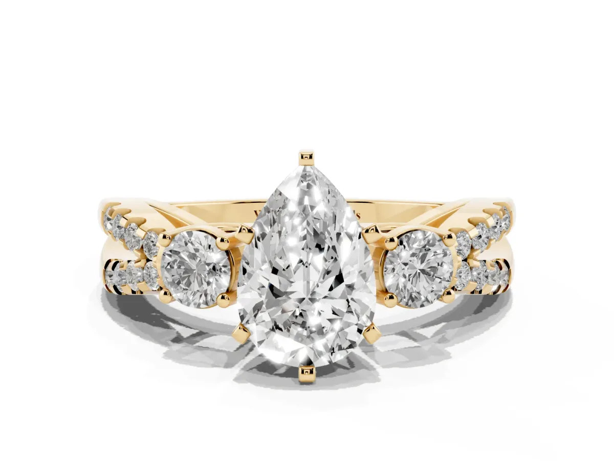 Pear Cut Diamond Three-Stone Ring with Pavé Split Shank and Four-Prong Setting Yellow gold