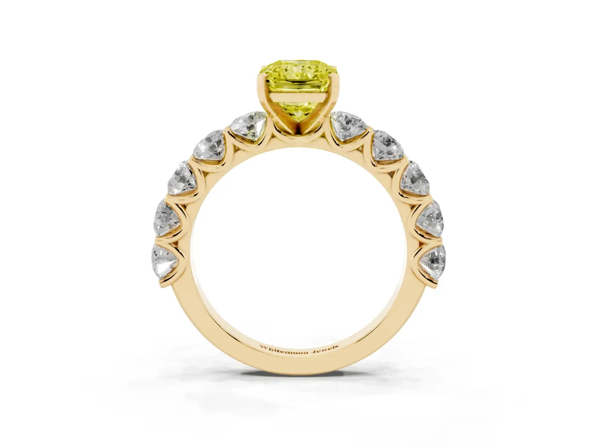 Fancy Yellow Radiant Cut Diamond Prong Setting with Side Stones on a Pave Band Yellow gold