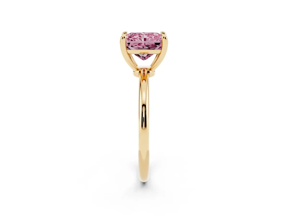 Fancy Pink Radiant Cut Solitaire Diamond Ring with 4-Prong Setting on a Classic Band Yellow gold