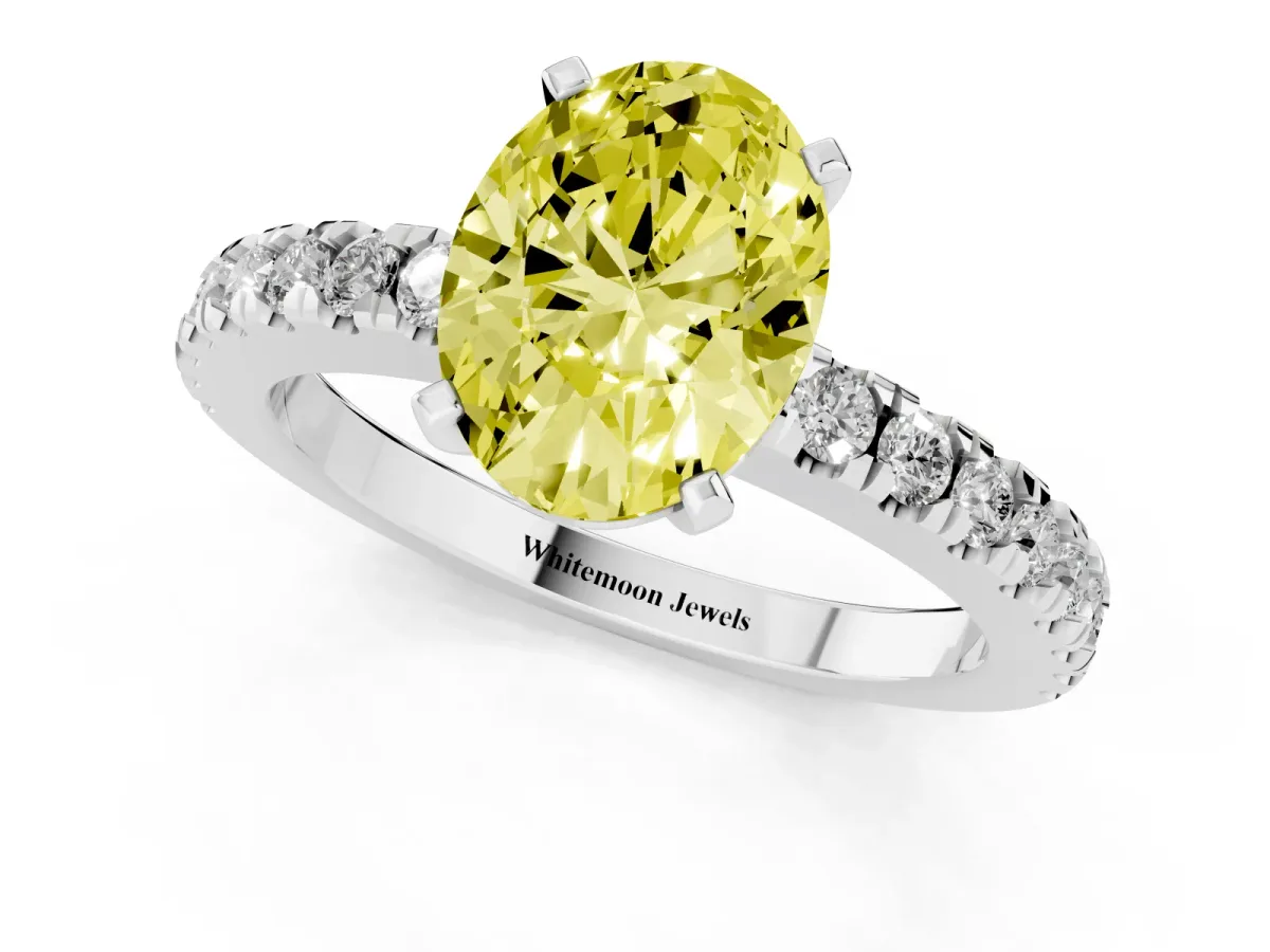 Fancy Yellow Oval Cut Solitaire Diamond with Pavé Band and Four-Prong Setting White gold