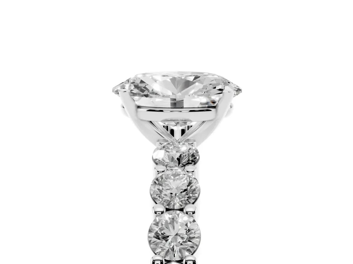 Oval Cut Diamond Solitaire Ring with Shared Prong Round Side Stones Silver