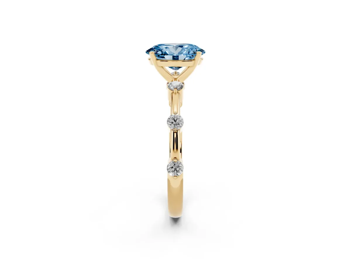 Fancy Blue Oval Cut Solitaire Diamond Ring with Bezel Set Side Stones and Prong Setting Yellow gold