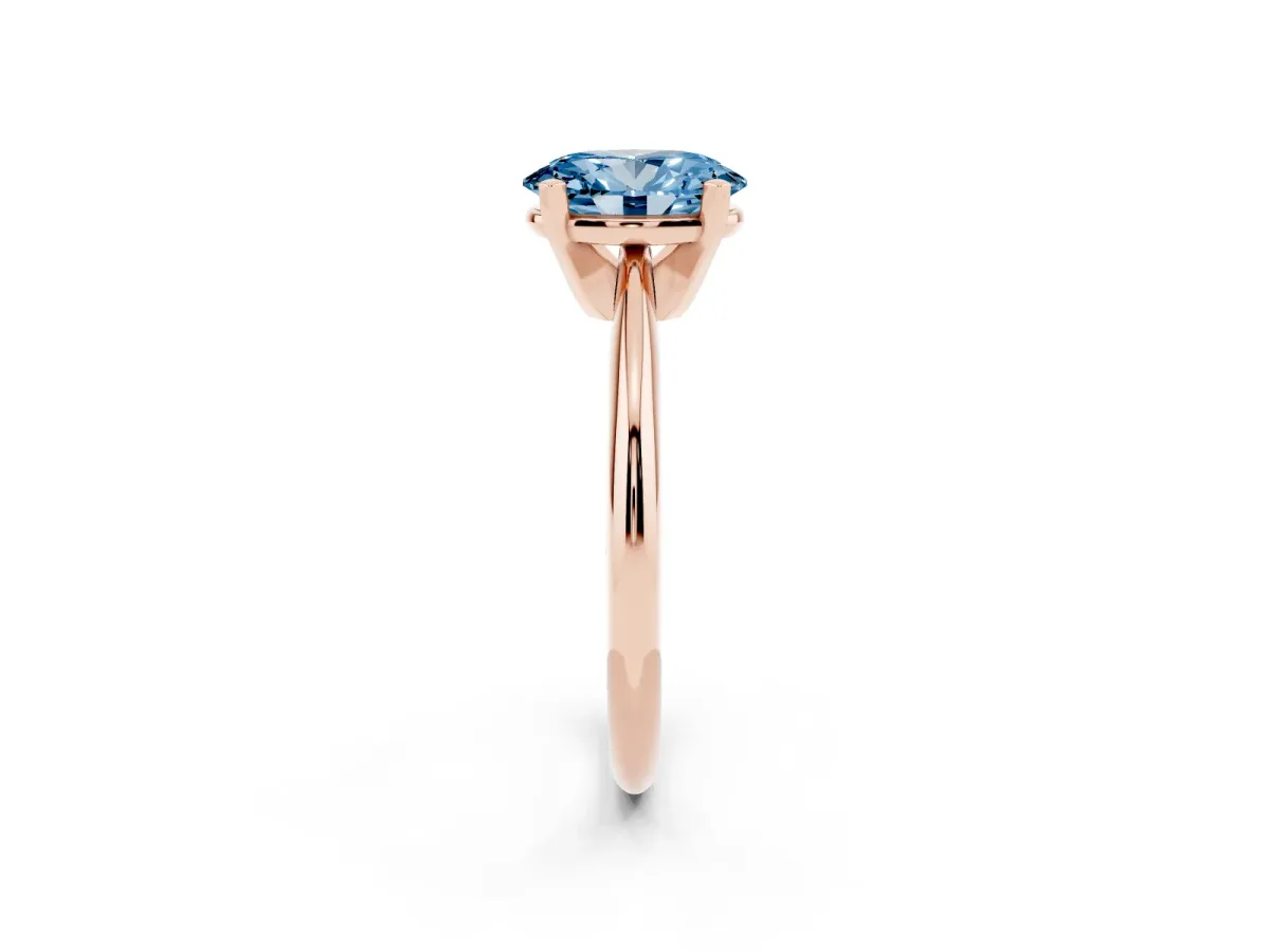Fancy Blue Oval Cut Cut Solitaire Ring with Four-Prong Setting on a Classic Band Rose gold