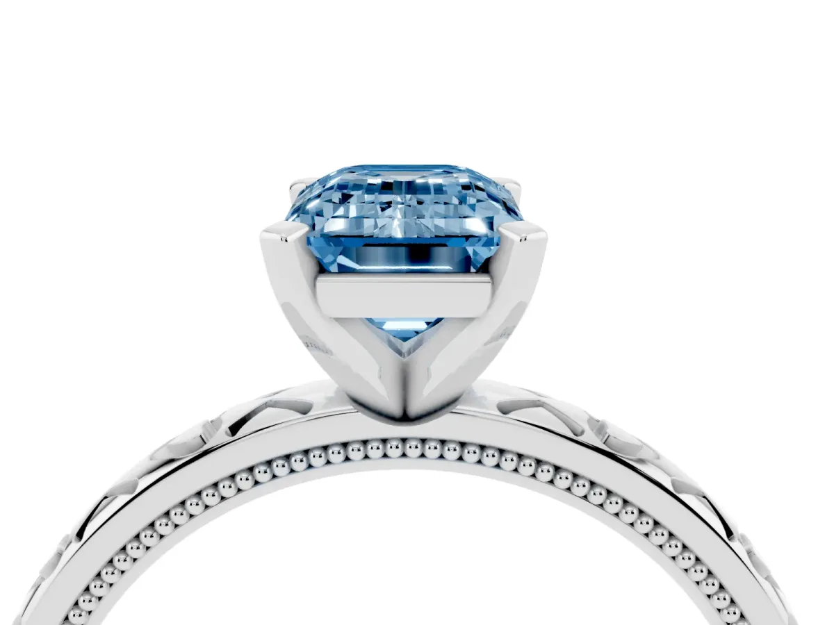 Fancy Blue Emerald Cut Solitaire Diamond Engagement Ring with XO Engraved Band and Four-Prong Setting Silver