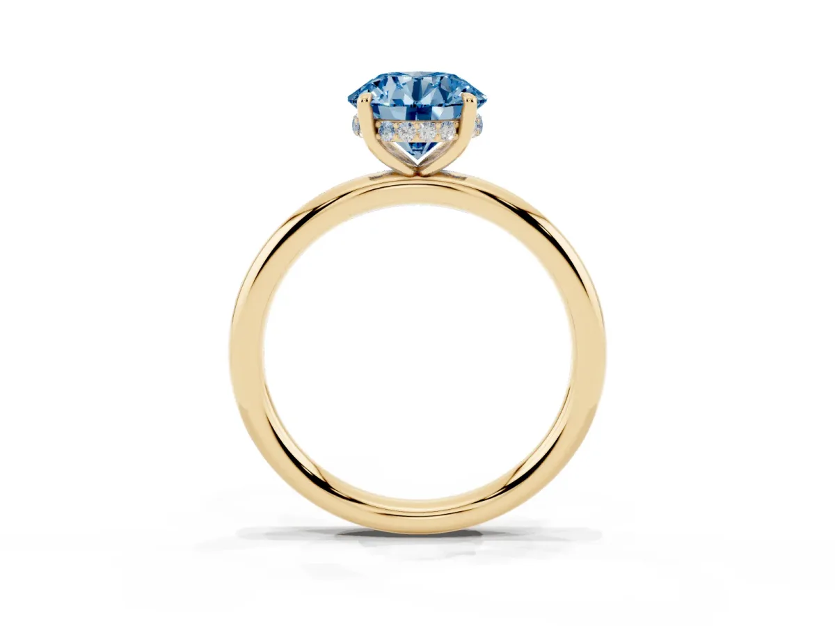 Fancy Blue Round Cut Diamond Solitaire Ring with Thin Band and Four-Prong Setting Yellow gold