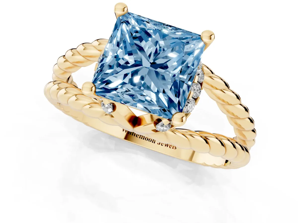 Fancy Blue Princess Cut Halo Twisted Band Four-Prong Ring Yellow gold