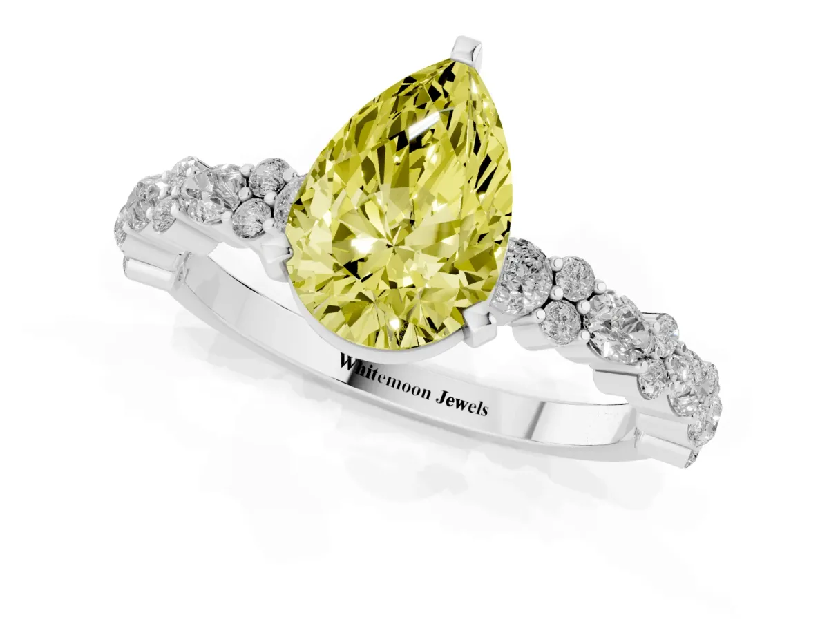 Fancy Yellow Pear Cut Diamond Side Stone Solitaire Ring with Round and Four-Prong Setting Platinum