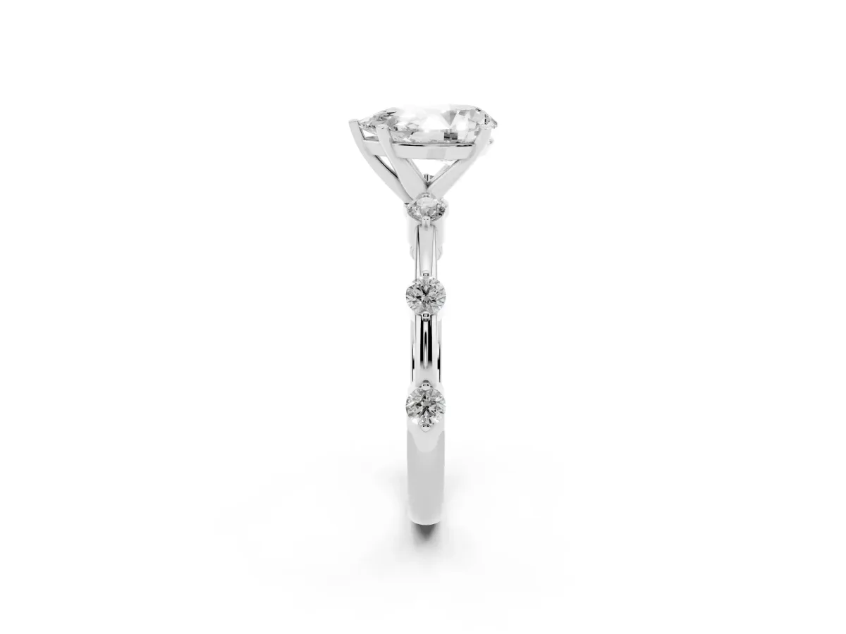 Pear Cut Solitaire Diamond Ring with Bezel Set Side Stones and Prong Setting White gold
