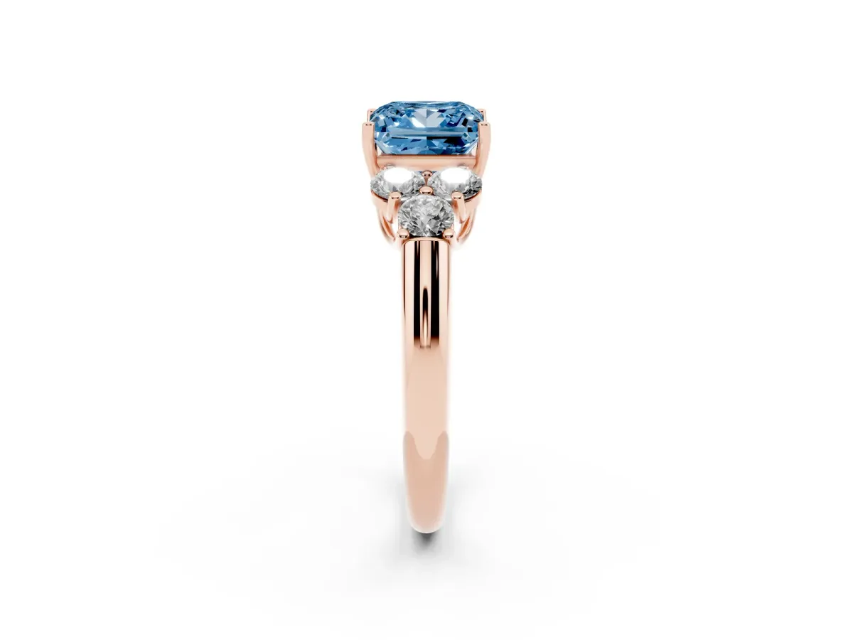 Fancy Blue Princess Cut Cut Diamond Cluster Ring with Round Accent Stones and Prong Setting on a Classic Band Rose gold