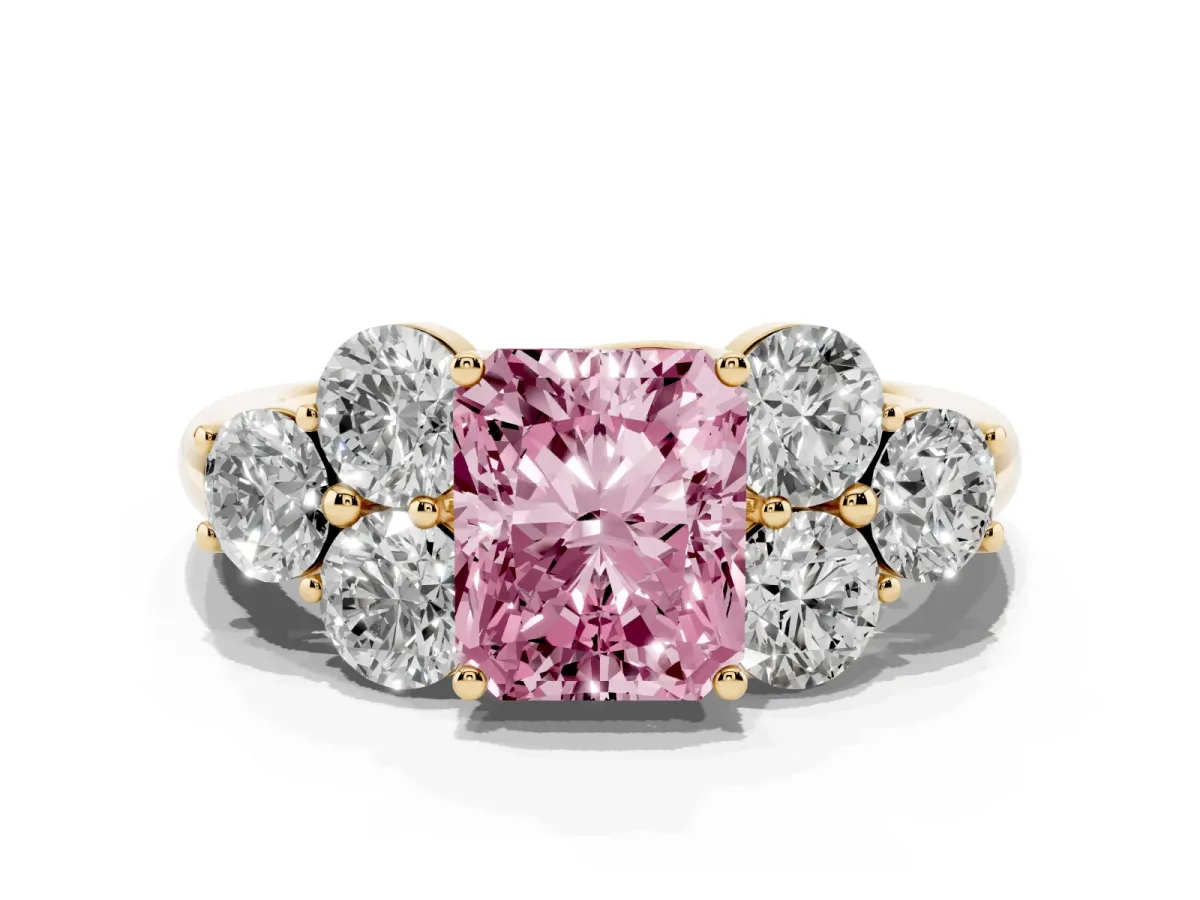 Fancy Pink Radiant Cut Cut Diamond Cluster Ring with Round Accent Stones and Prong Setting on a Classic Band Yellow gold